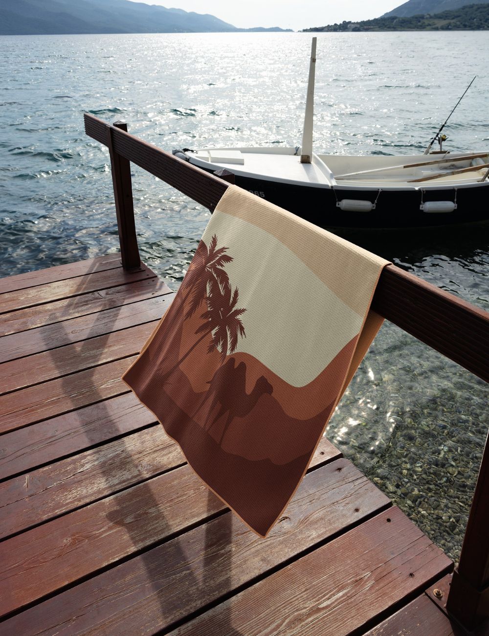 46 Beach towel on a rail by the sea