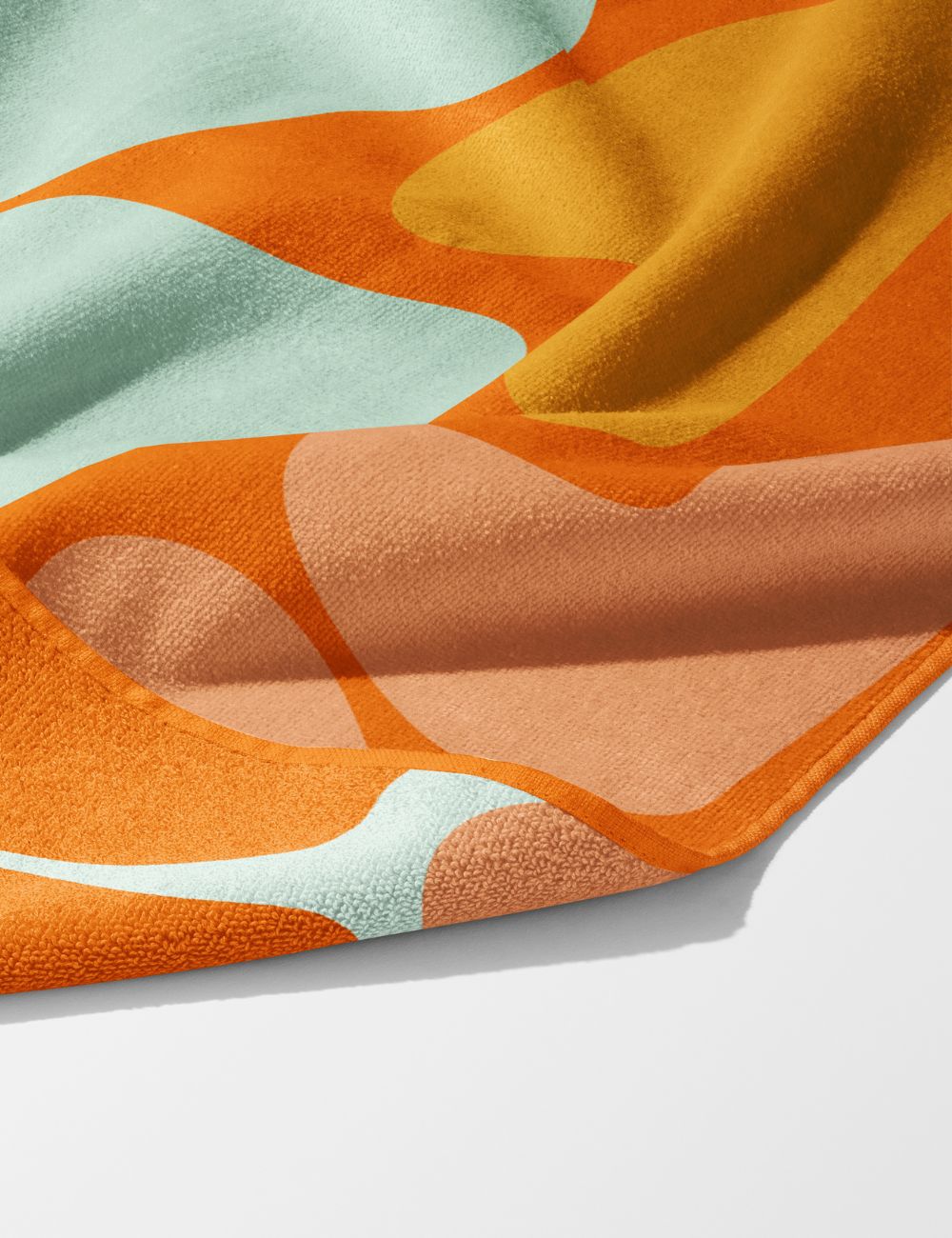 62 Retro Bloom colourful gym towel – white background, zoomed in bottom right, corner folded to show reverse