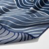 Shore Waves beach-style gym towel – white background, zoomed in bottom right, corner folded to show reverse