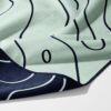 Midnight Topo eco gym towel Australia – white background, zoomed in bottom right, corner folded to show reverse