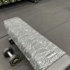 A gym towel thrown over gym equipment